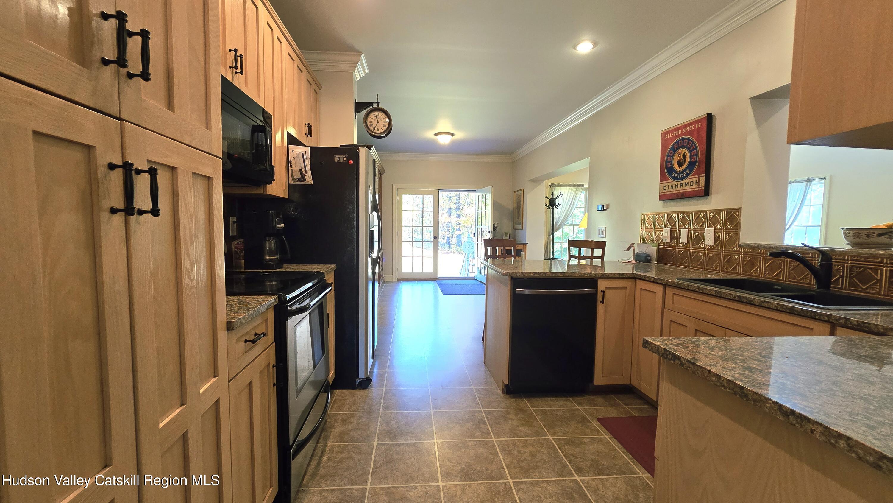 3124-3100 County Rte 9 Canaan, NY 12060 - Photo 19 of 45 a kitchen with stainless steel appliances granite countertop a refrigerator and a sink