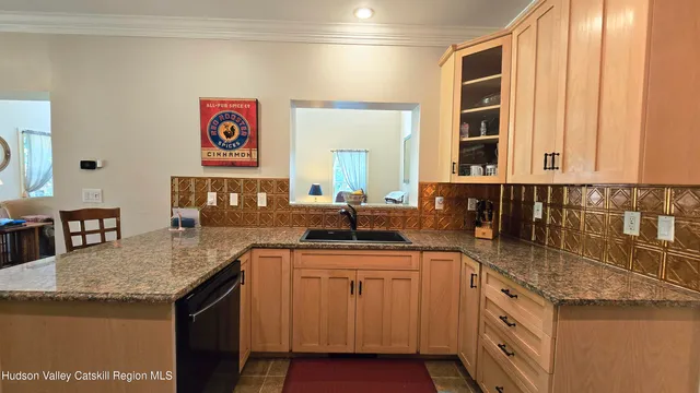 a kitchen with stainless steel appliances granite countertop a sink and cabinets
