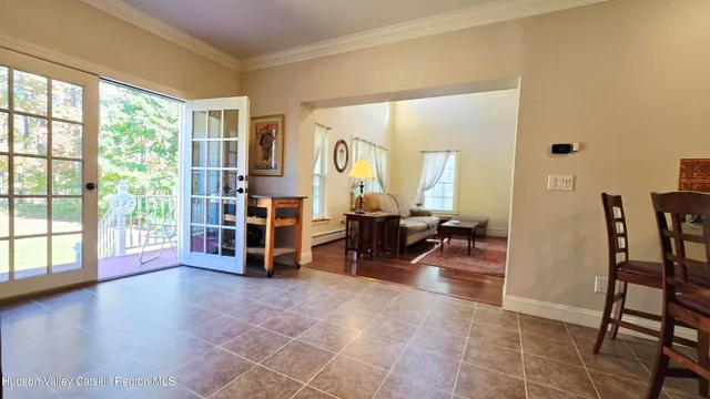 a view of a livingroom with furniture and a window
