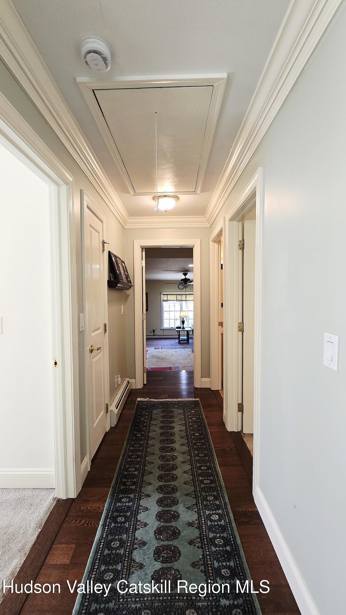 3124-3100 County Rte 9 Canaan, NY 12060 - Photo 31 of 45 a view of a hallway with wooden floor