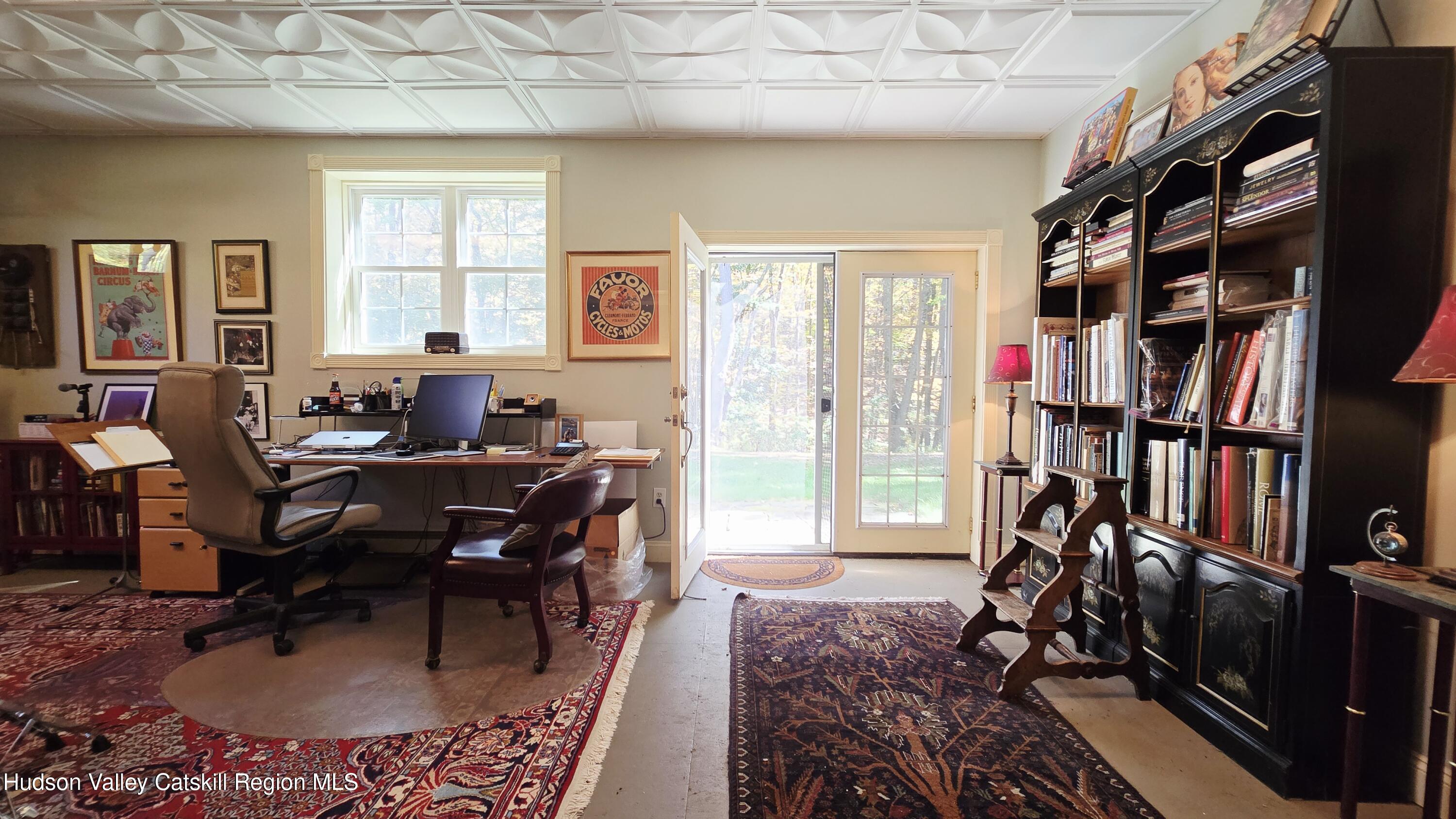 3124-3100 County Rte 9 Canaan, NY 12060 - Photo 37 of 45 a workspace with furniture bookshelf and a window