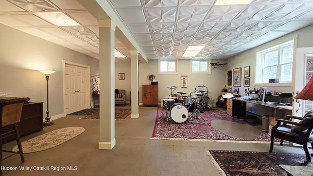 a view of a livingroom with furniture and a window