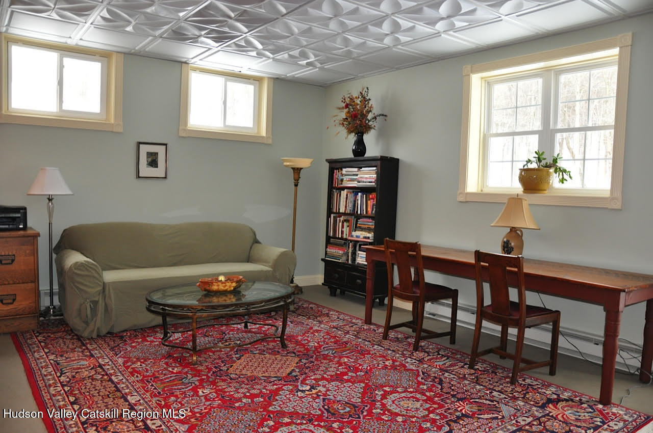 3124-3100 County Rte 9 Canaan, NY 12060 - Photo 40 of 45 a living room with furniture a rug and a window