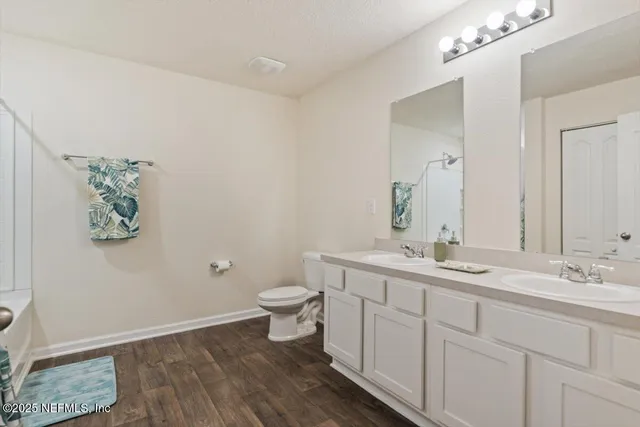 a bedroom with a bed and a view of bathroom