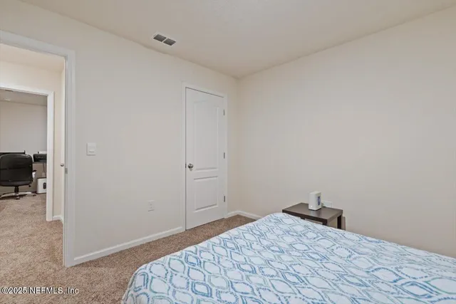 a bathroom with a sink toilet and mirror