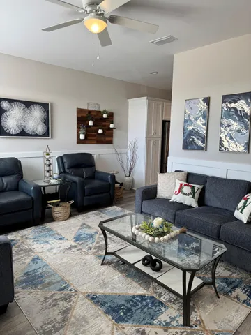 a living room with furniture and a flat screen tv