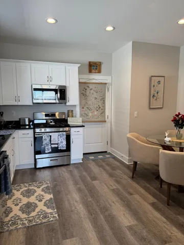 a living room with furniture and a lamp