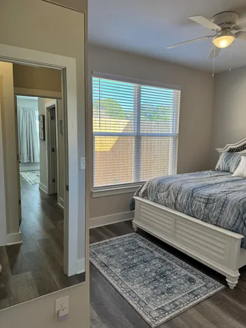 a kitchen with stainless steel appliances kitchen island granite countertop a sink a stove a dining table and chairs