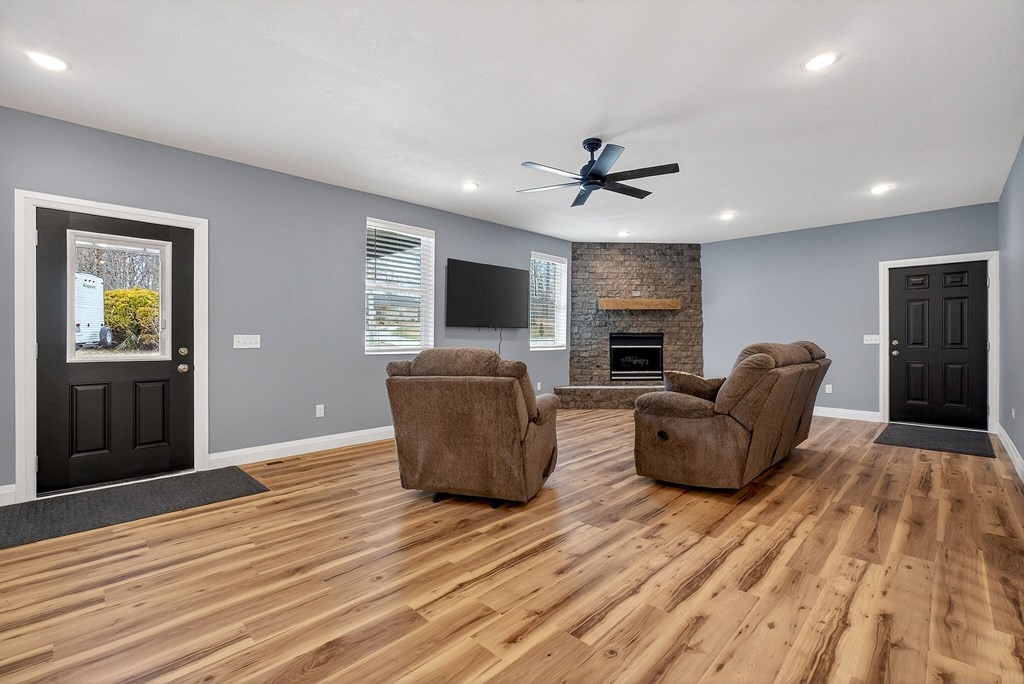 365 Spring Haven Lane Sparta, TN 38583 - Photo 11 of 60 a living room with furniture a fireplace and a flat screen tv