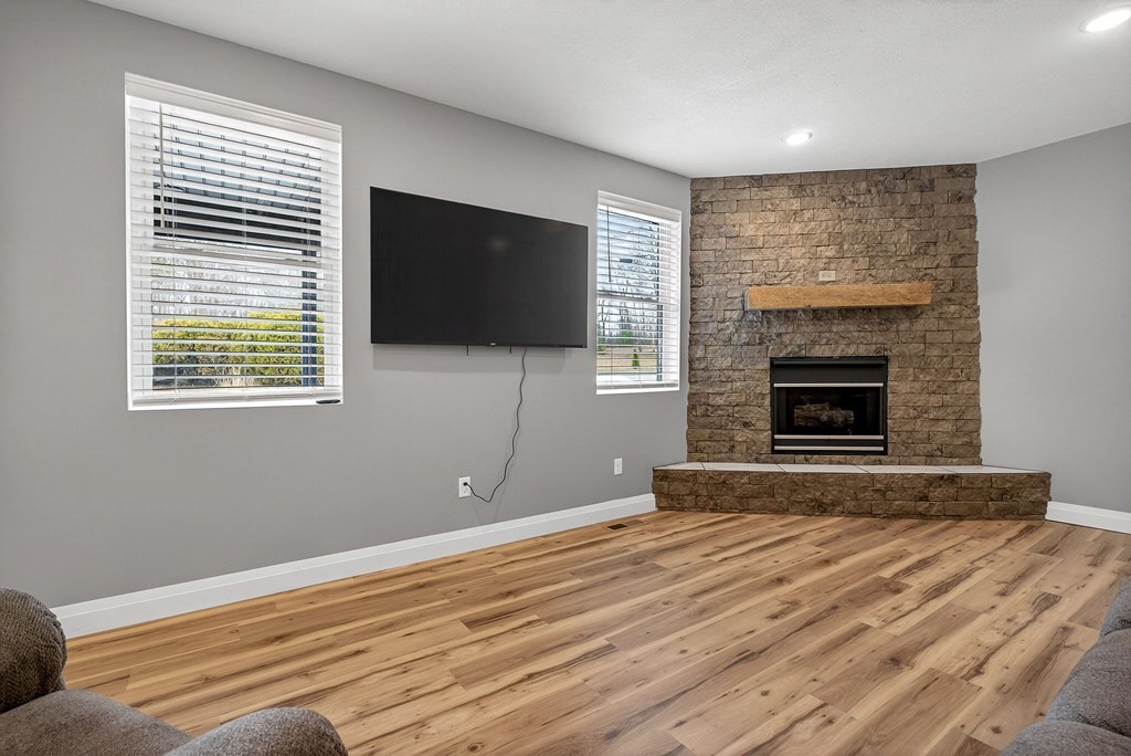 365 Spring Haven Lane Sparta, TN 38583 - Photo 12 of 60 a view of livingroom with wooden floor and a fireplace