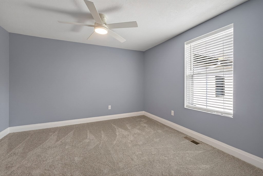 365 Spring Haven Lane Sparta, TN 38583 - Photo 24 of 60 an empty room with a window and a fan