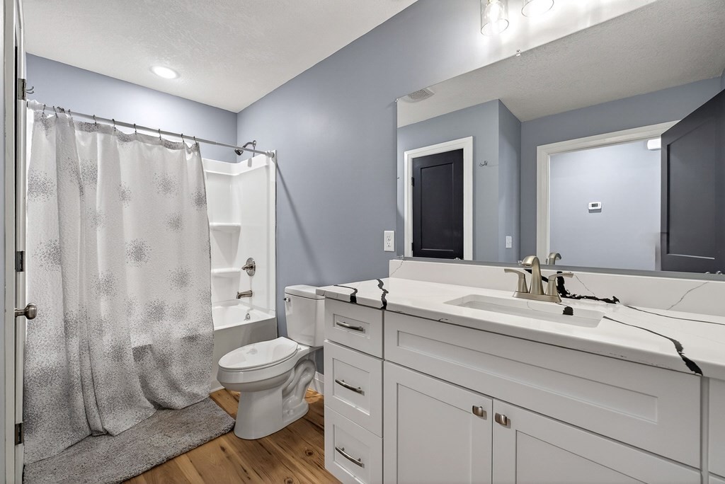 365 Spring Haven Lane Sparta, TN 38583 - Photo 26 of 60 a bathroom with a sink toilet vanity and shower