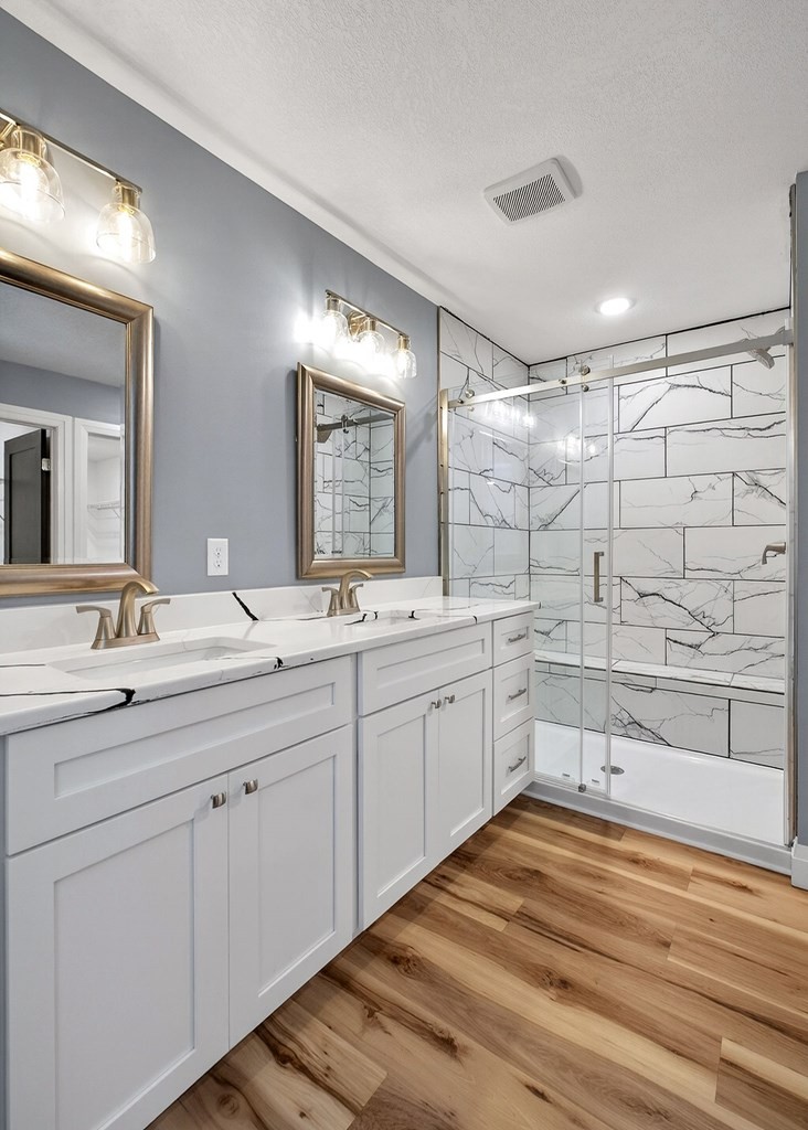 365 Spring Haven Lane Sparta, TN 38583 - Photo 30 of 60 a spacious bathroom with a double vanity sink mirror and shower