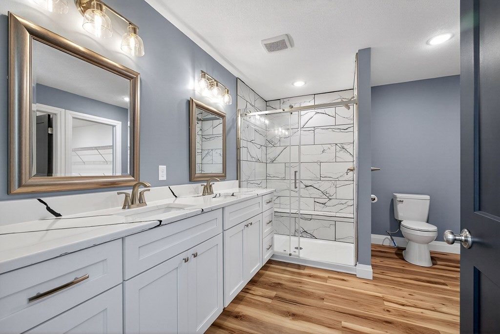 365 Spring Haven Lane Sparta, TN 38583 - Photo 31 of 60 a spacious bathroom with a double vanity sink a toilet and a mirror