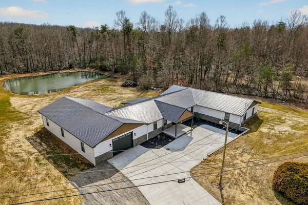 a view of a swimming pool with a yard