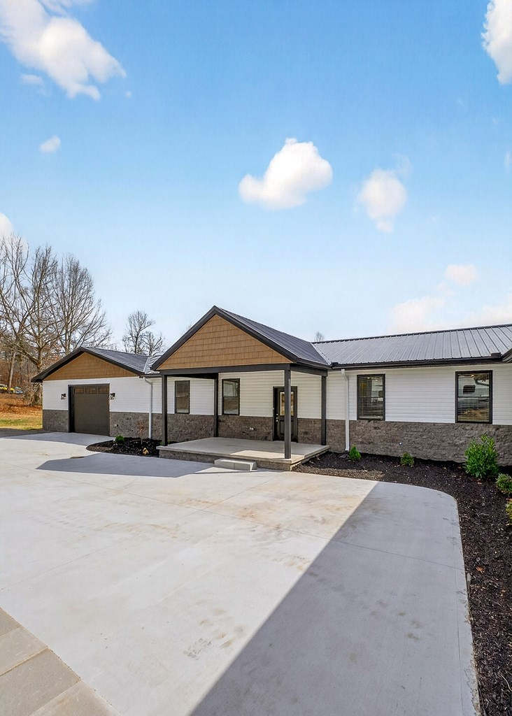 365 Spring Haven Lane Sparta, TN 38583 - Photo 54 of 60 a front view of a house with a yard and garage