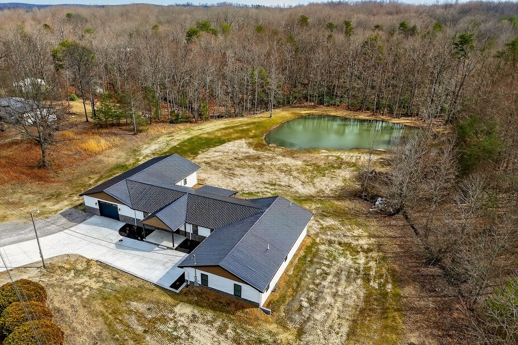 365 Spring Haven Lane Sparta, TN 38583 - Photo 7 of 60 a view of a swimming pool with lounge chair