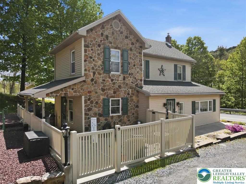 4880 Little Gap Road Kunkletown, PA 18058 - Photo 66 of 100 This charming residence features stone and siding, complemented by a porch and sturdy fencing.