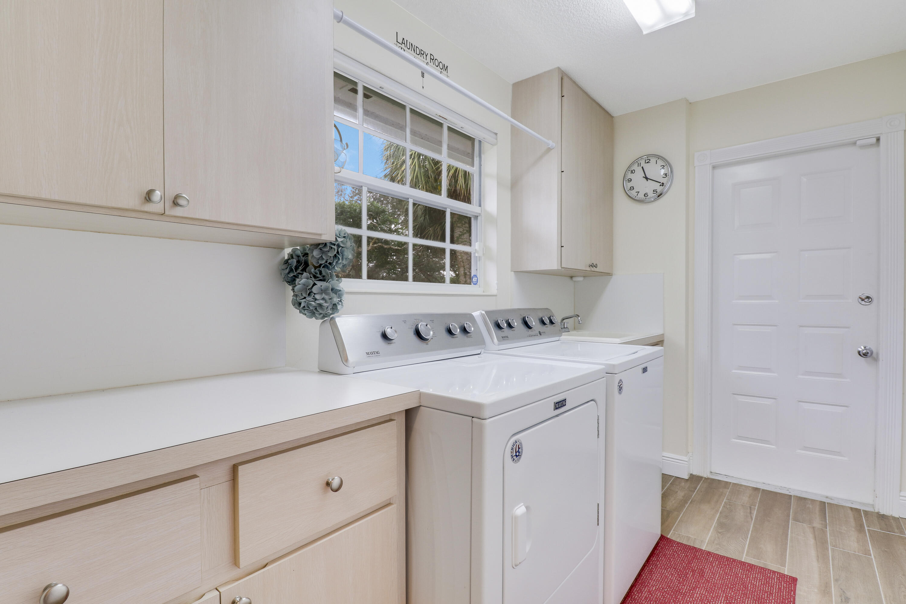 175 Brier Circle Jupiter, FL 33458 - Photo 31 of 39 Laundry Room with Garage Access