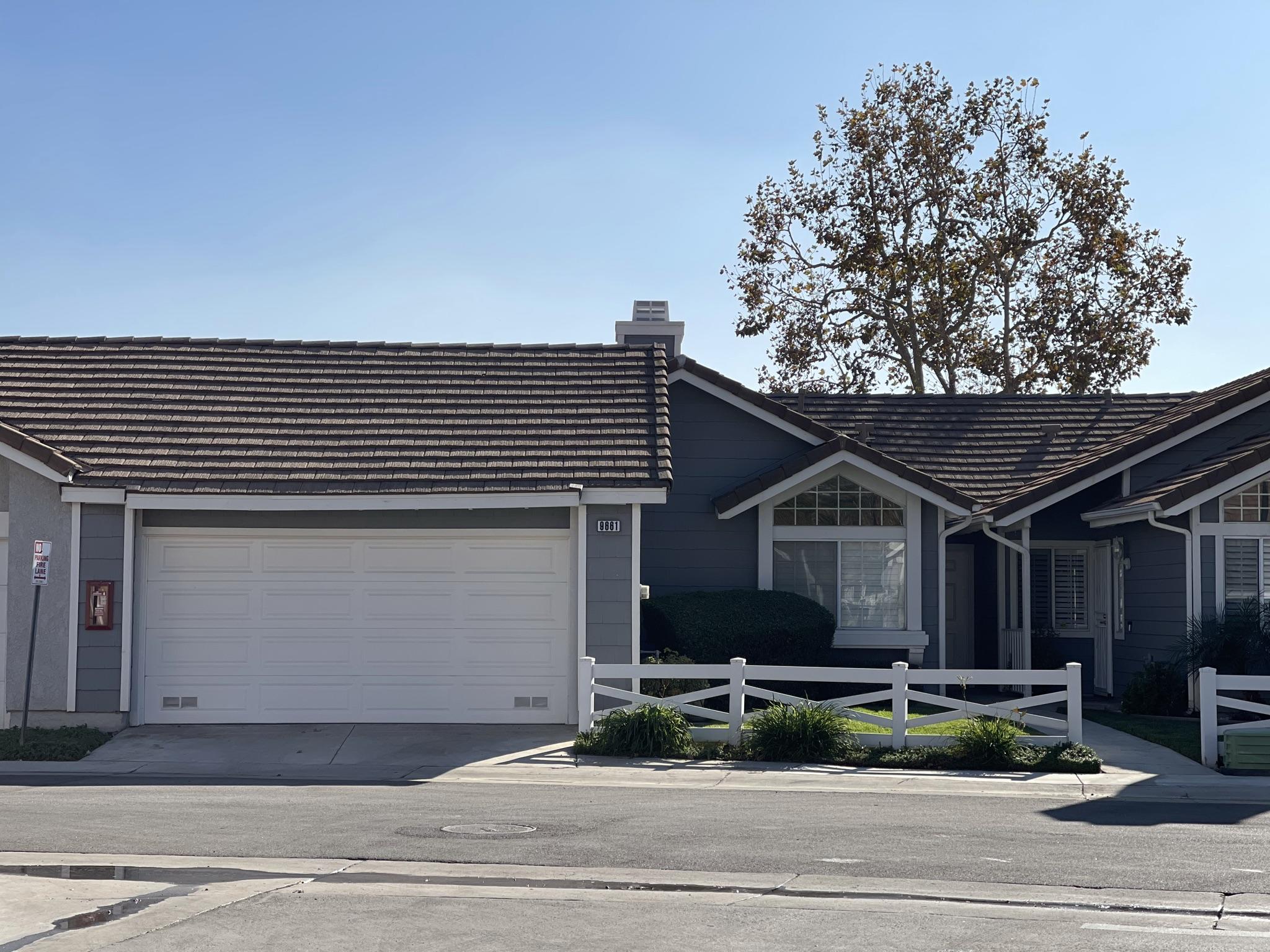 9661 Northampton Drive Rancho Cucamonga, CA 91737 - Photo 2 of 27 a front view of a house with a yard