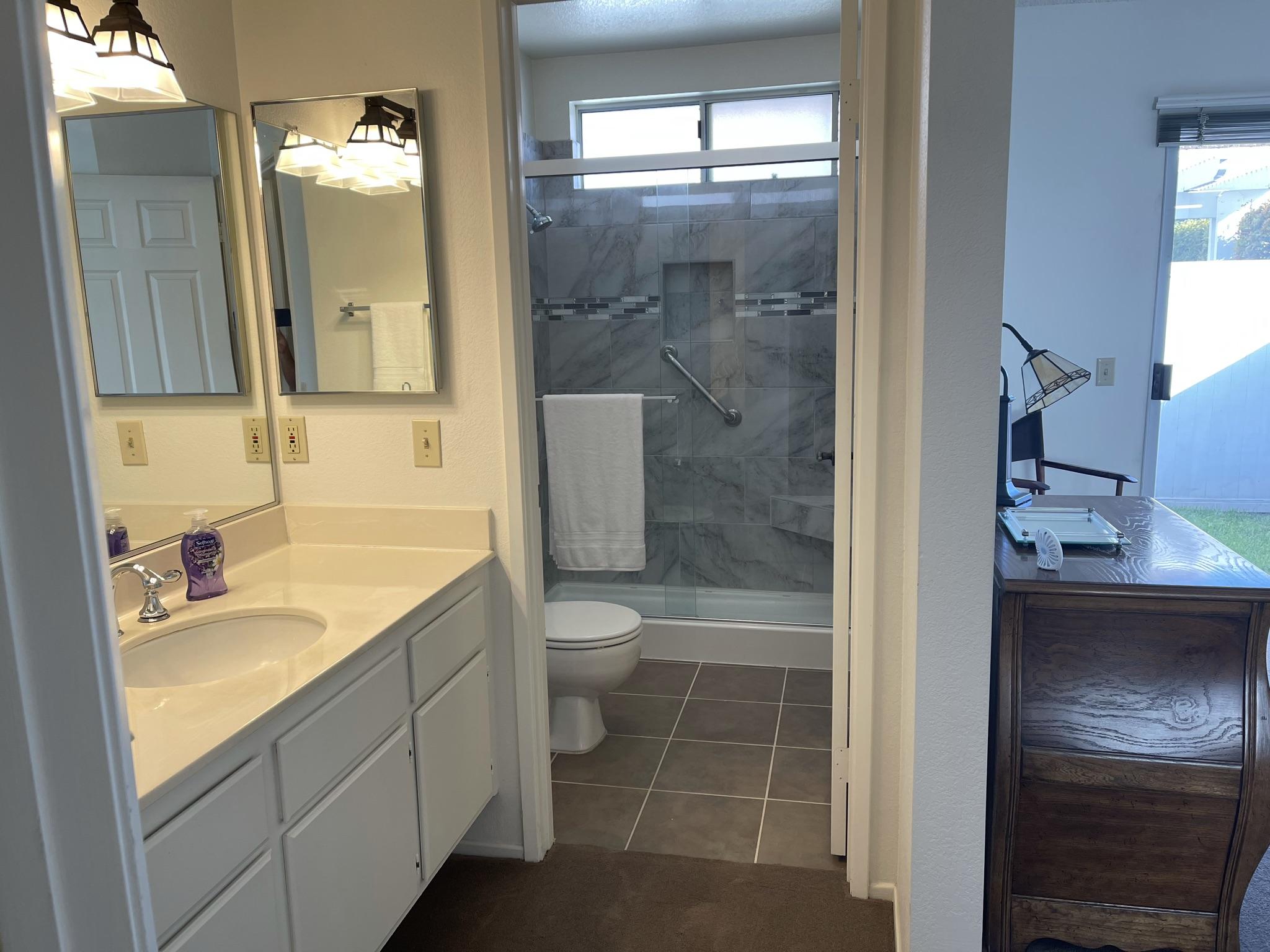 9661 Northampton Drive Rancho Cucamonga, CA 91737 - Photo 15 of 27 a bathroom with a granite countertop sink toilet and shower