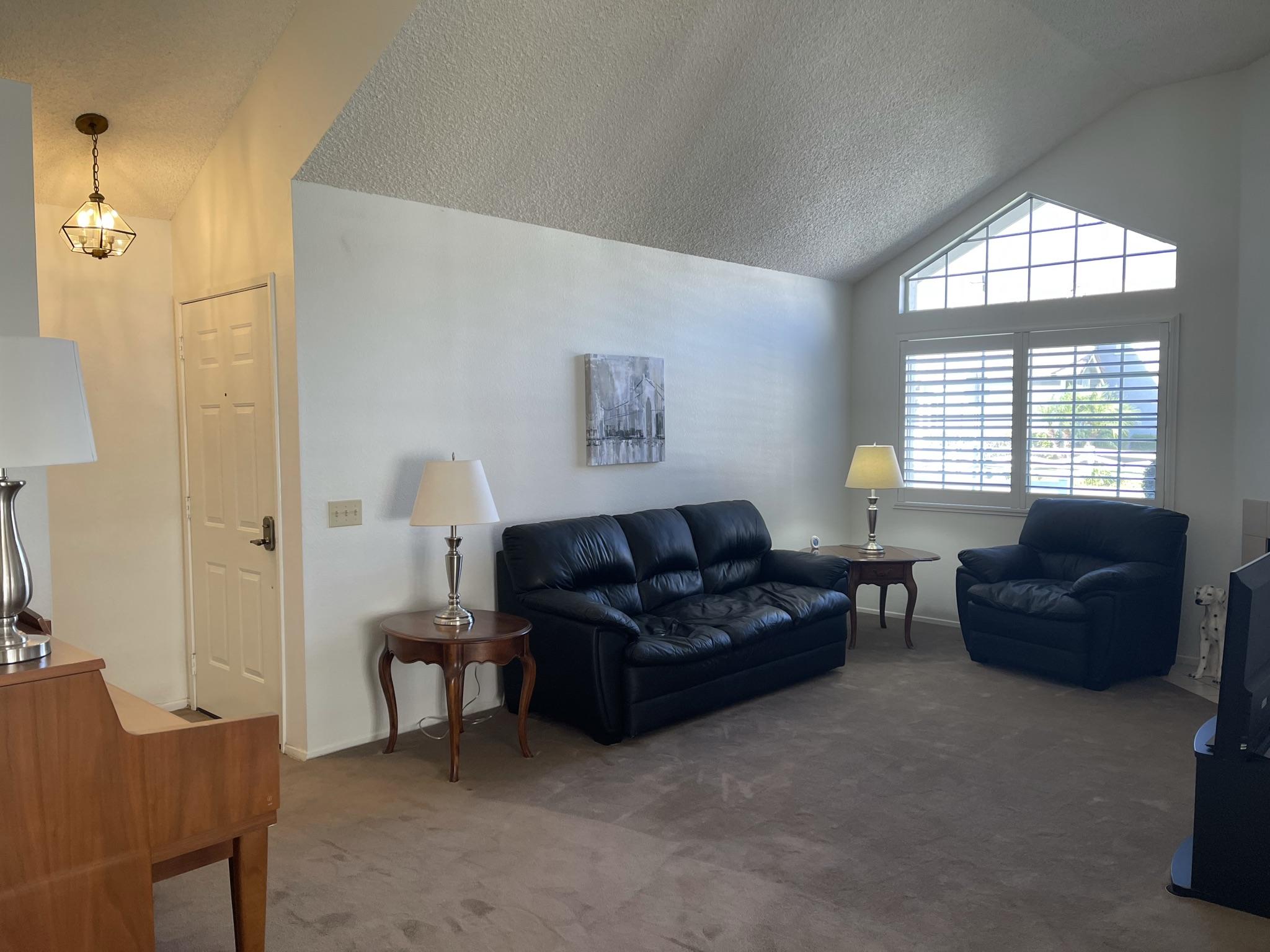 9661 Northampton Drive Rancho Cucamonga, CA 91737 - Photo 4 of 27 a living room with furniture and a window