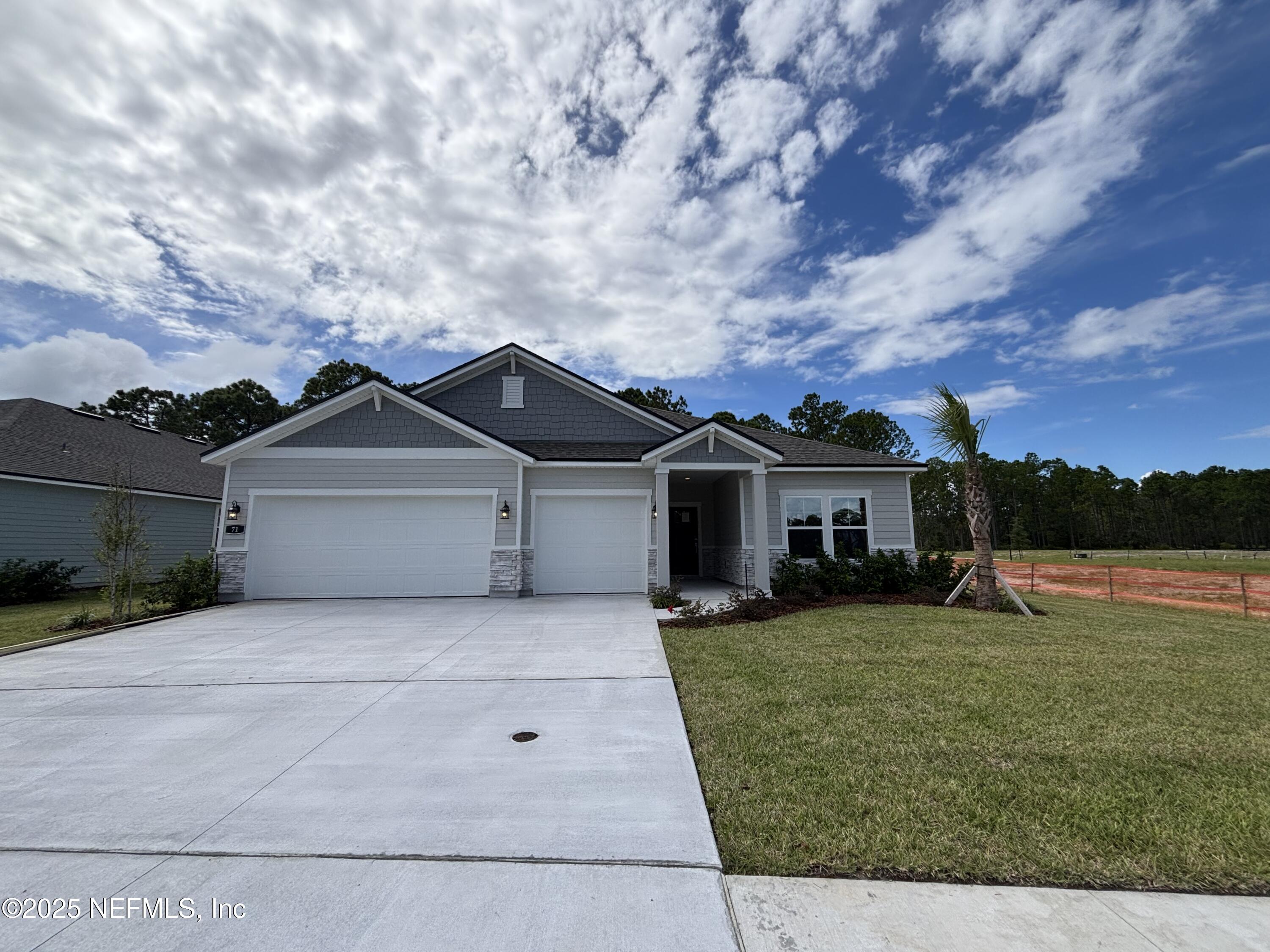 71 Pegasus Road Flagler Beach, FL 32136 - Photo 1 of 25 front view of house with a yard