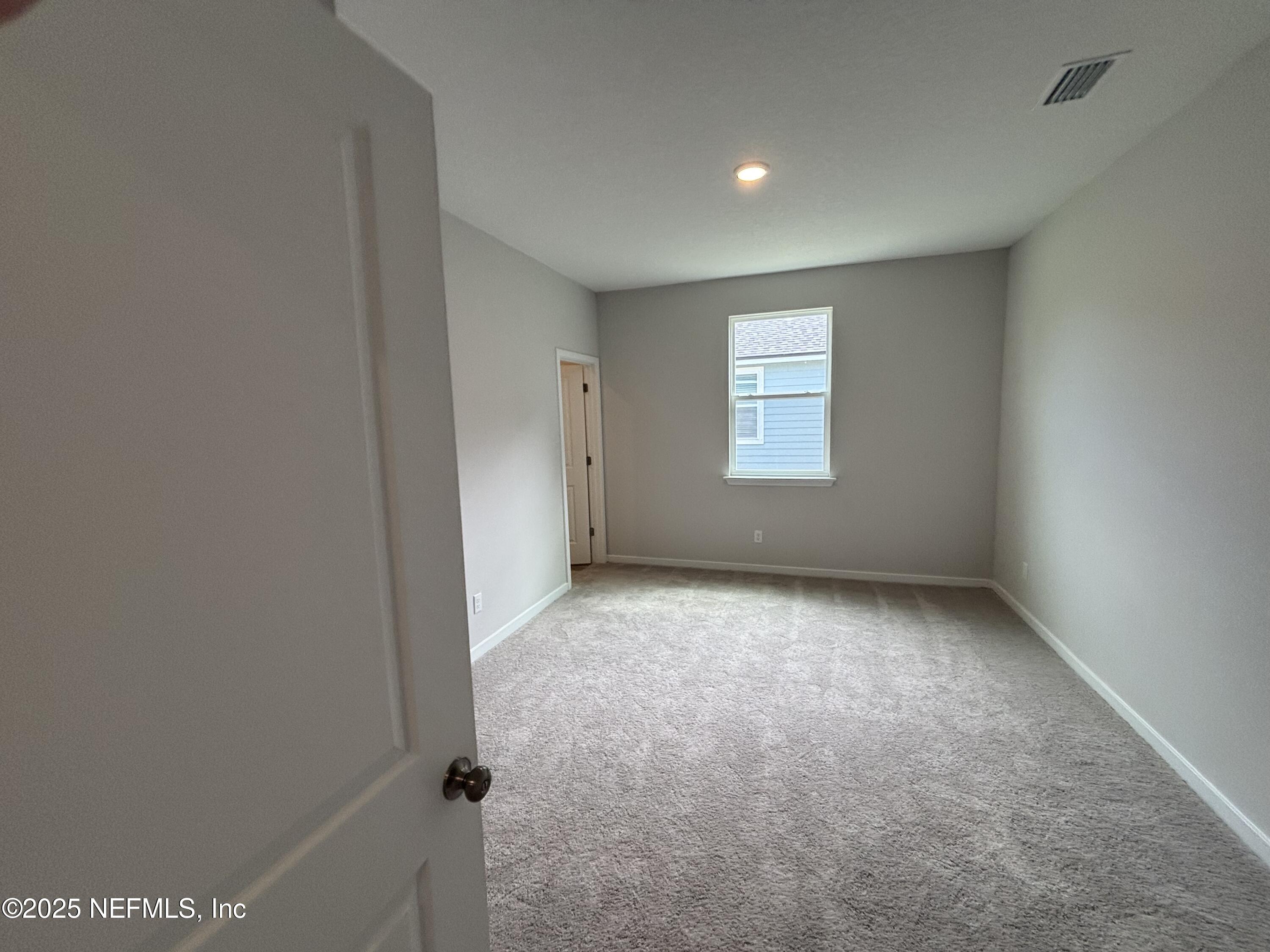 71 Pegasus Road Flagler Beach, FL 32136 - Photo 11 of 25 a view of an empty room with a window