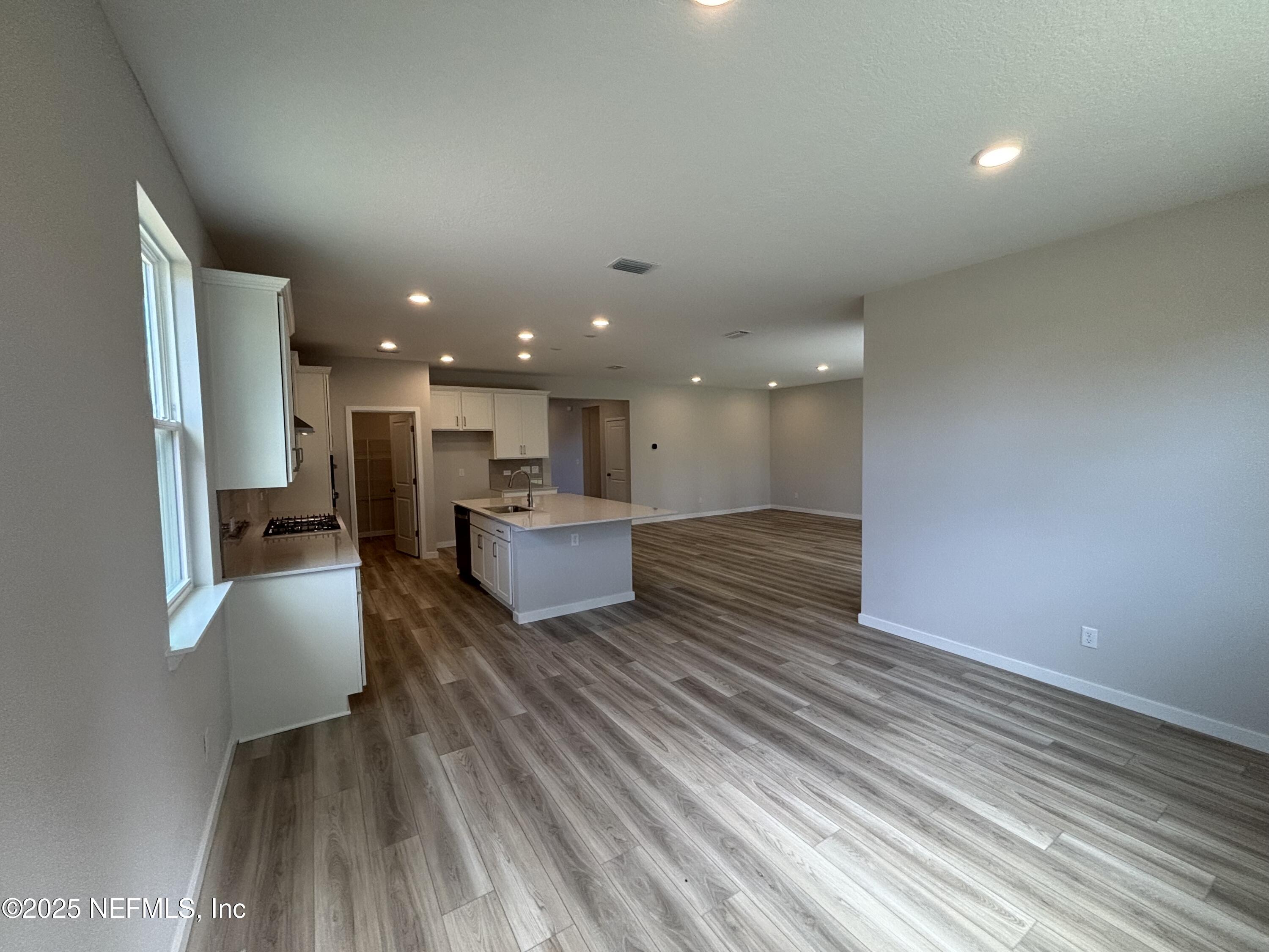 71 Pegasus Road Flagler Beach, FL 32136 - Photo 16 of 25 a view of kitchen with kitchen island microwave and refrigerator