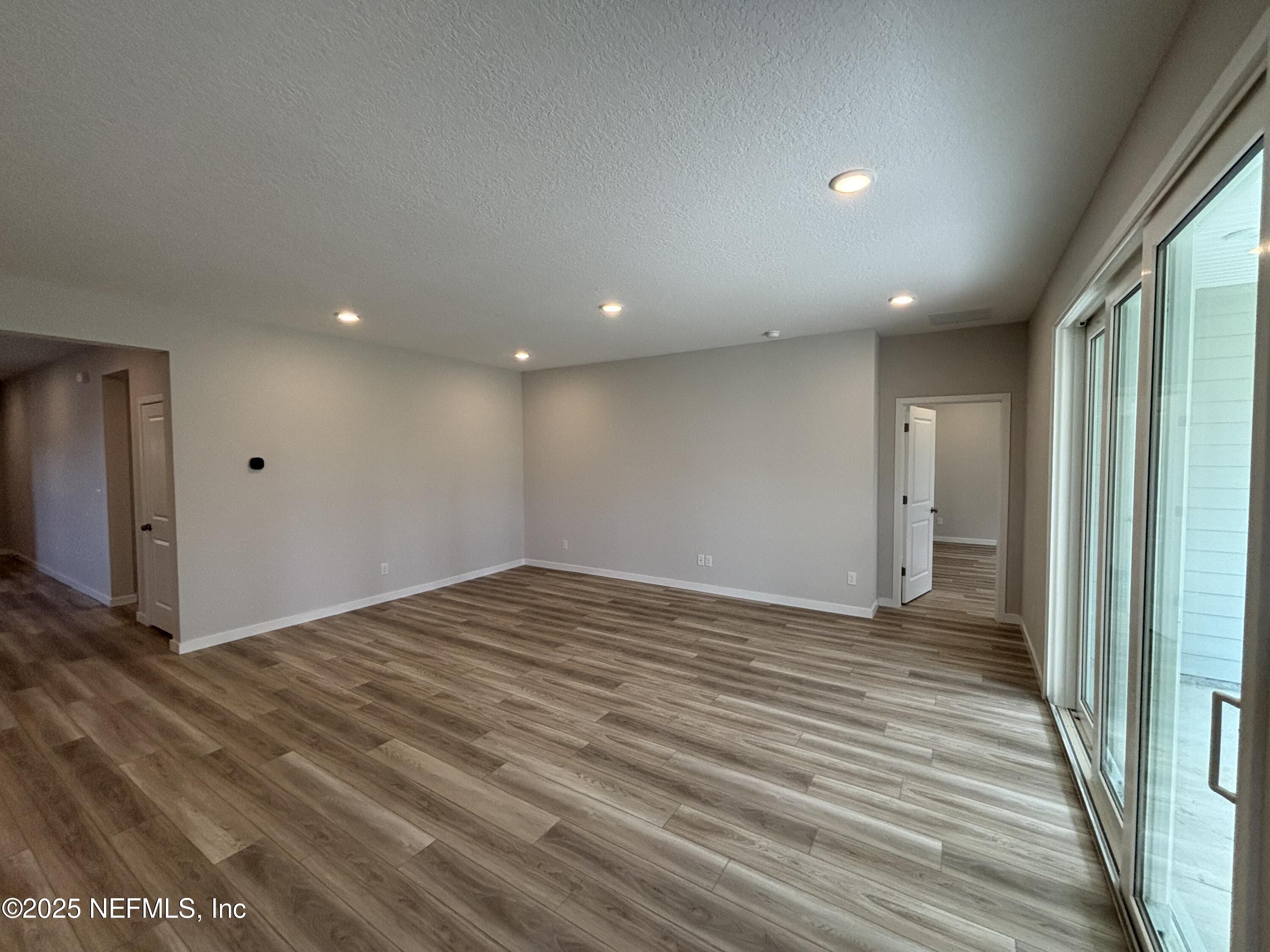71 Pegasus Road Flagler Beach, FL 32136 - Photo 19 of 25 a view of empty room with wooden floor
