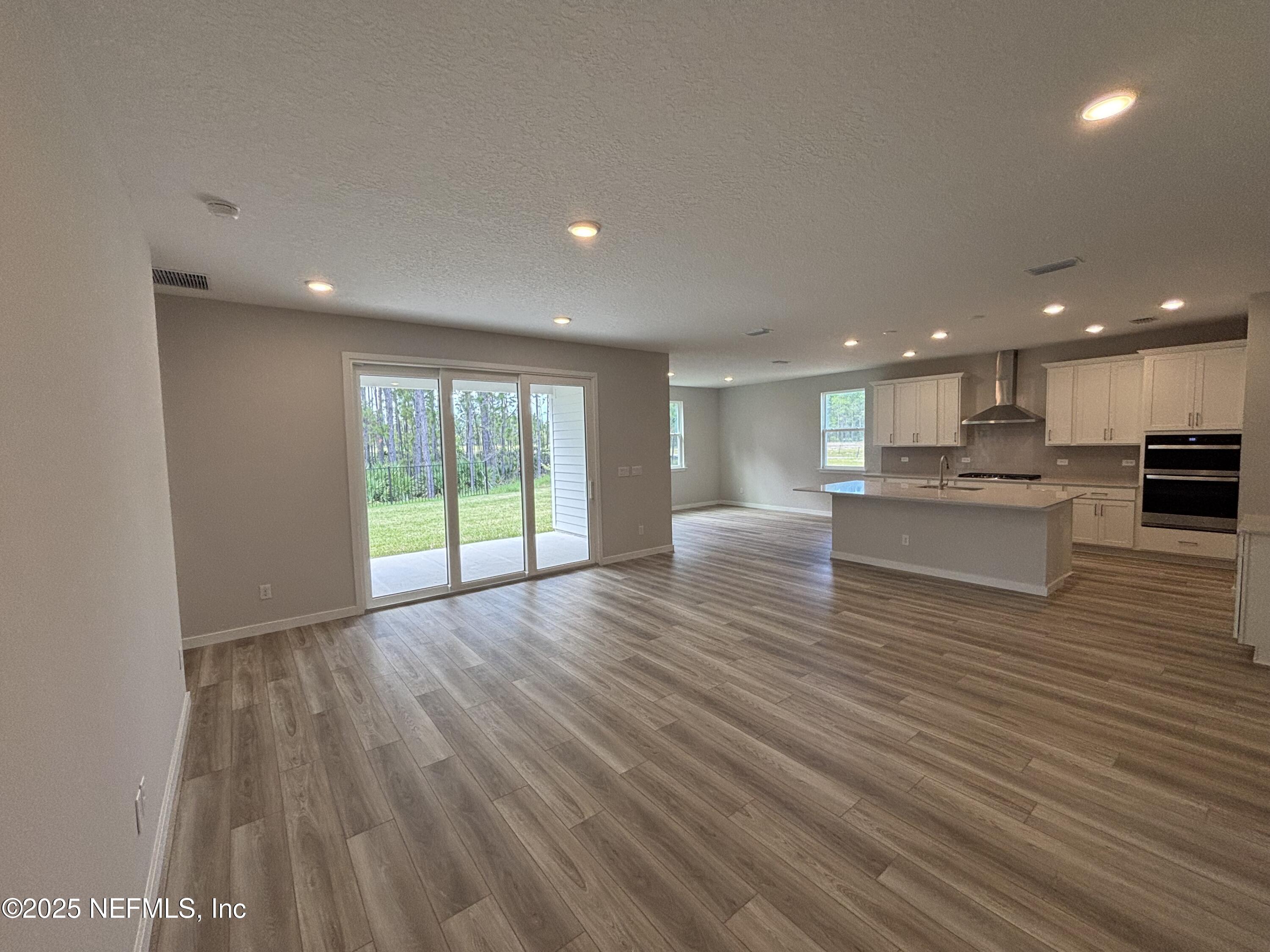71 Pegasus Road Flagler Beach, FL 32136 - Photo 20 of 25 a view of kitchen with cabinets and wooden floor