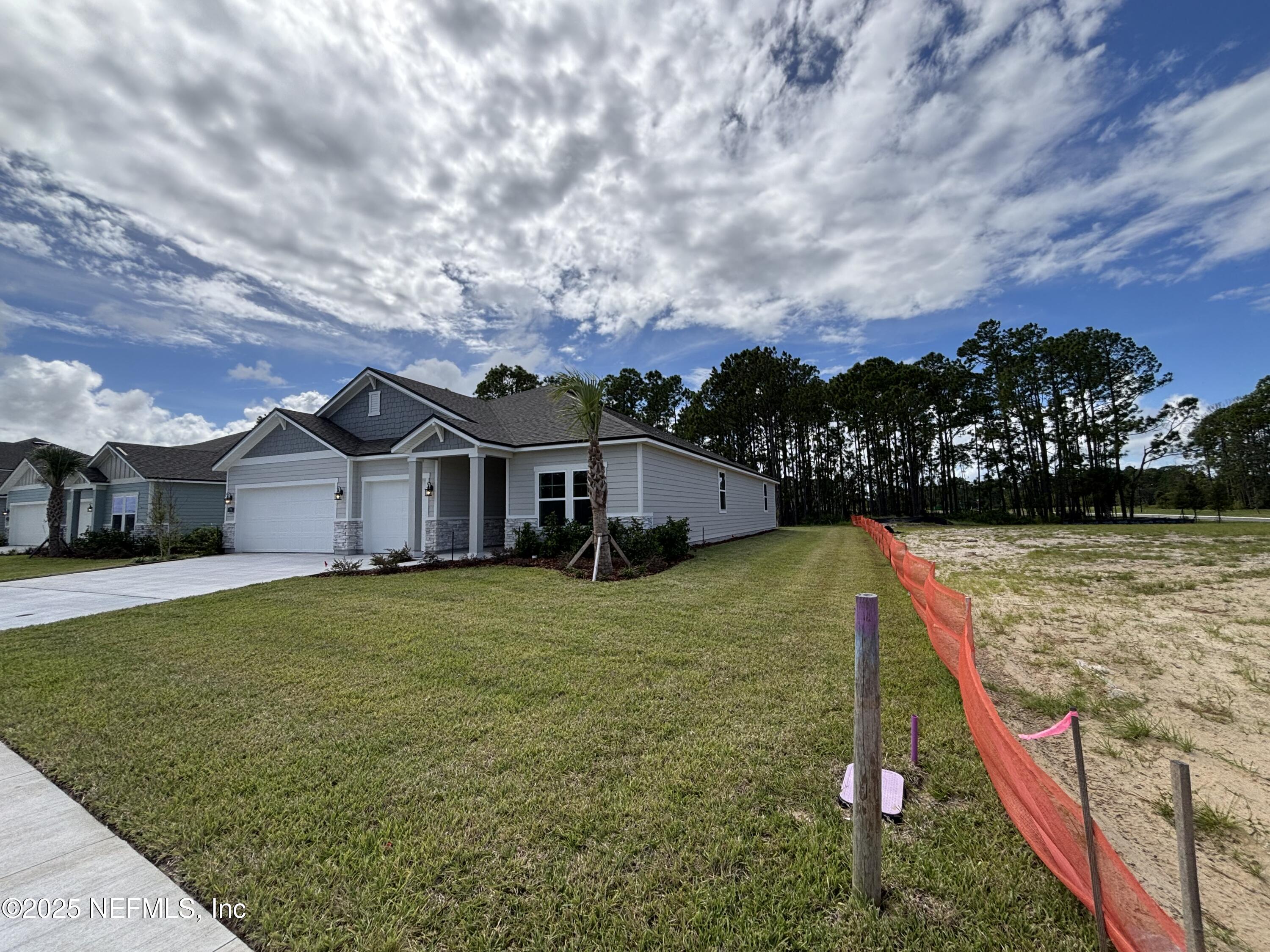 71 Pegasus Road Flagler Beach, FL 32136 - Photo 2 of 25 a front view of a house with a yard