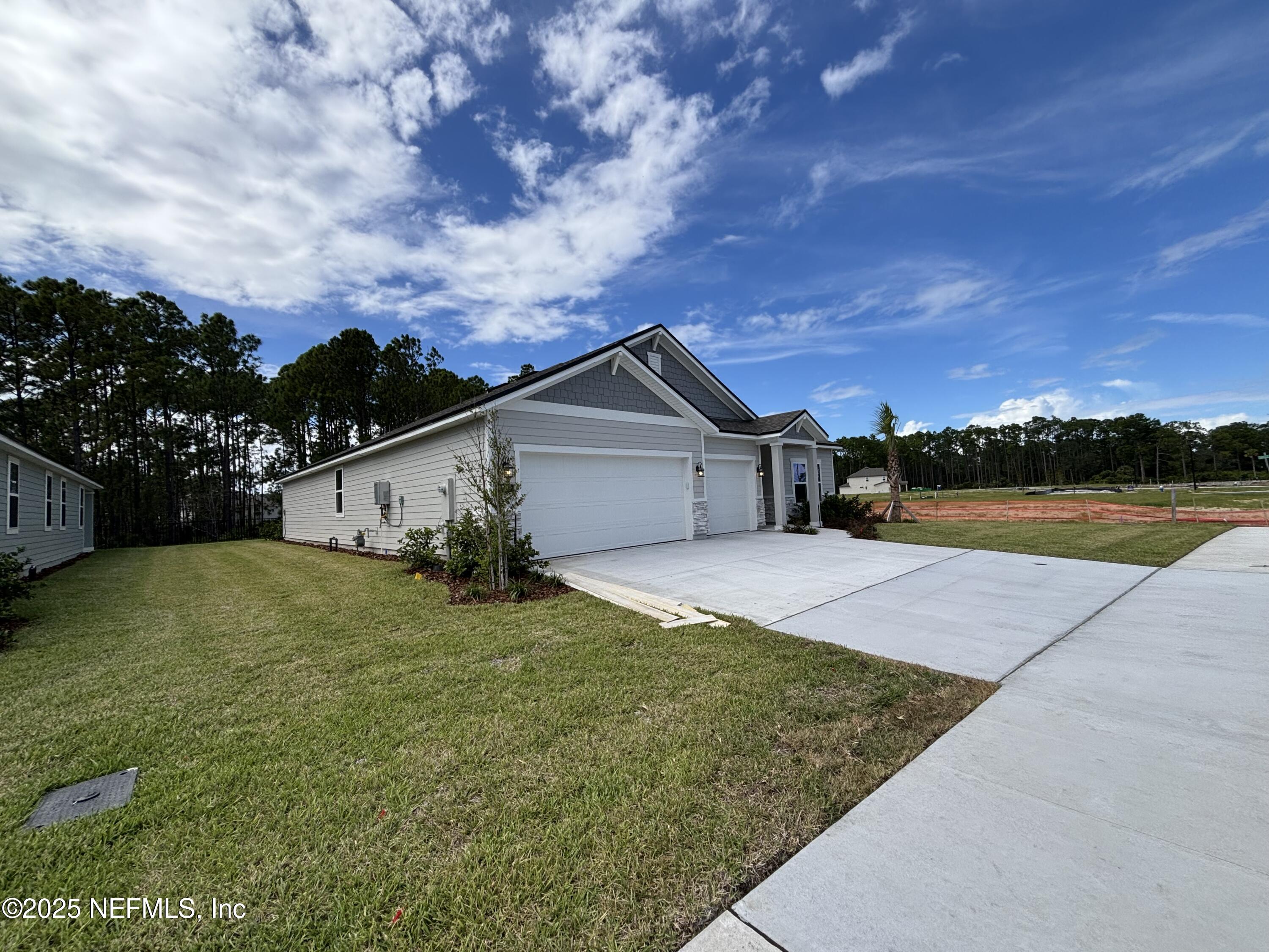 71 Pegasus Road Flagler Beach, FL 32136 - Photo 3 of 25 a view of outdoor space yard and house