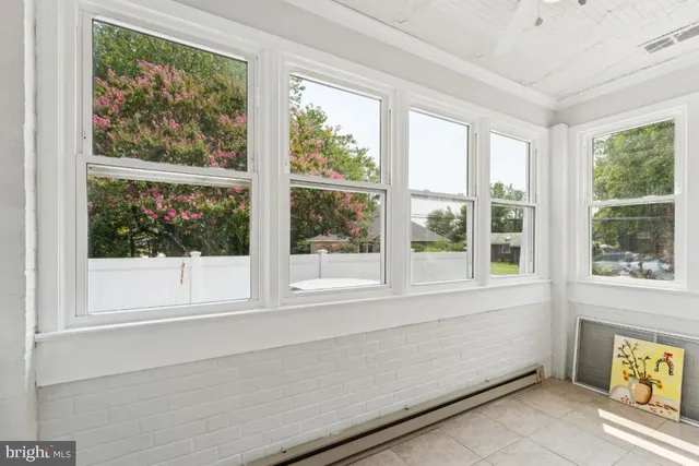 a view of a chair and table in the backyard