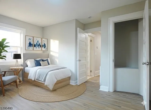 a spacious bedroom with a bed and a table