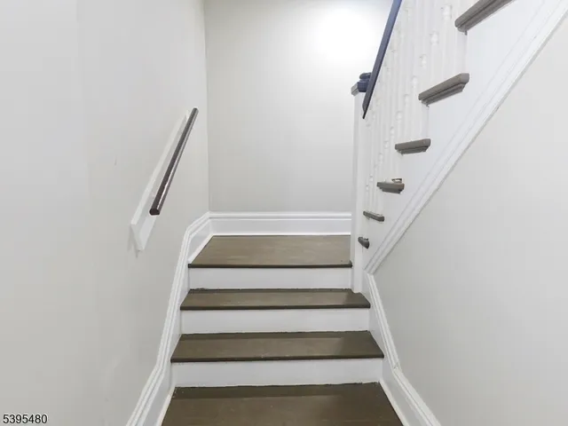 a view of staircase with white walls