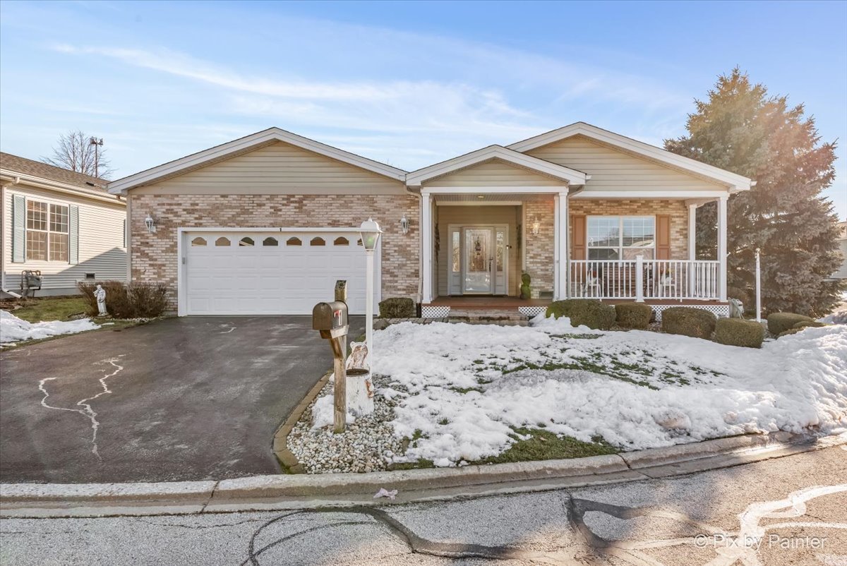 1 Suffolk Way Grayslake, IL 60030 - Photo 2 of 54 a view of a house with snow on the side of the road