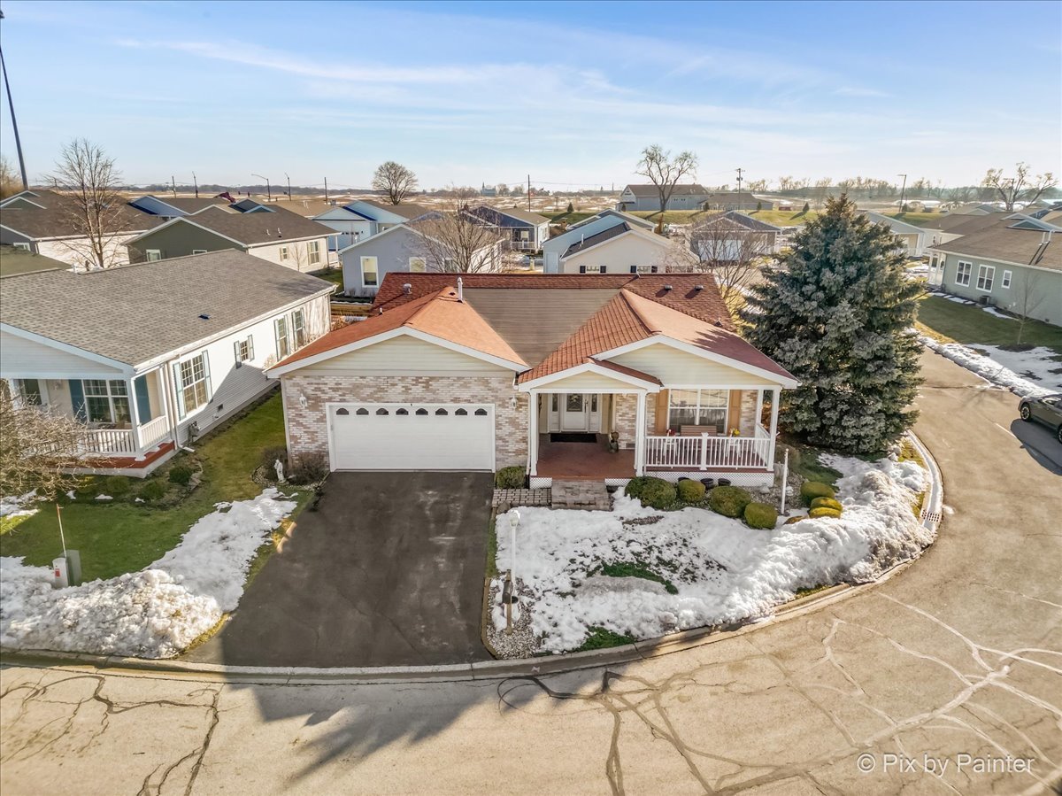 1 Suffolk Way Grayslake, IL 60030 - Photo 3 of 54 a view of a big house with a mountain in the background