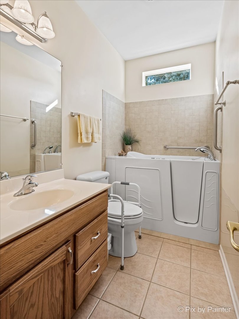 1 Suffolk Way Grayslake, IL 60030 - Photo 33 of 54 a bathroom with a granite countertop toilet sink and mirror