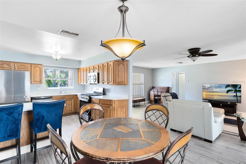 5331 Maize Street Orlando, FL 32821 - Photo 11 of 35 a kitchen with granite countertop lots of stainless steel appliances granite countertop lots of counter top space