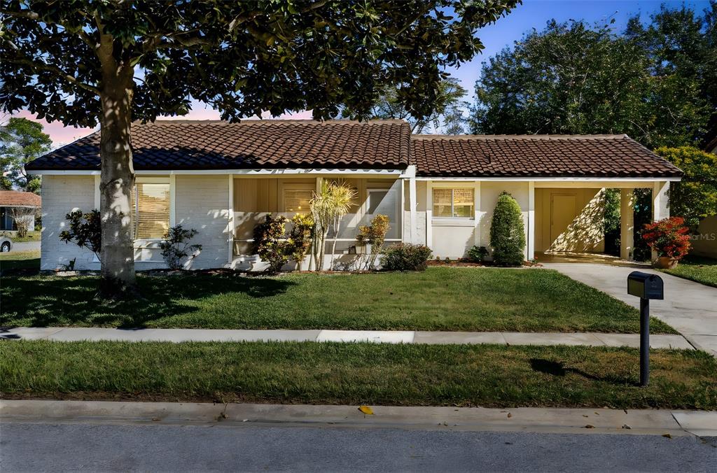 5331 Maize Street Orlando, FL 32821 - Photo 2 of 35 front view of a house with a yard