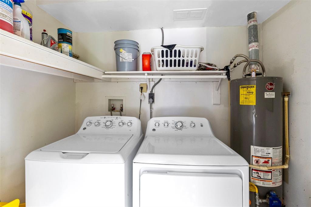 5331 Maize Street Orlando, FL 32821 - Photo 22 of 35 a utility room with dryer and washer