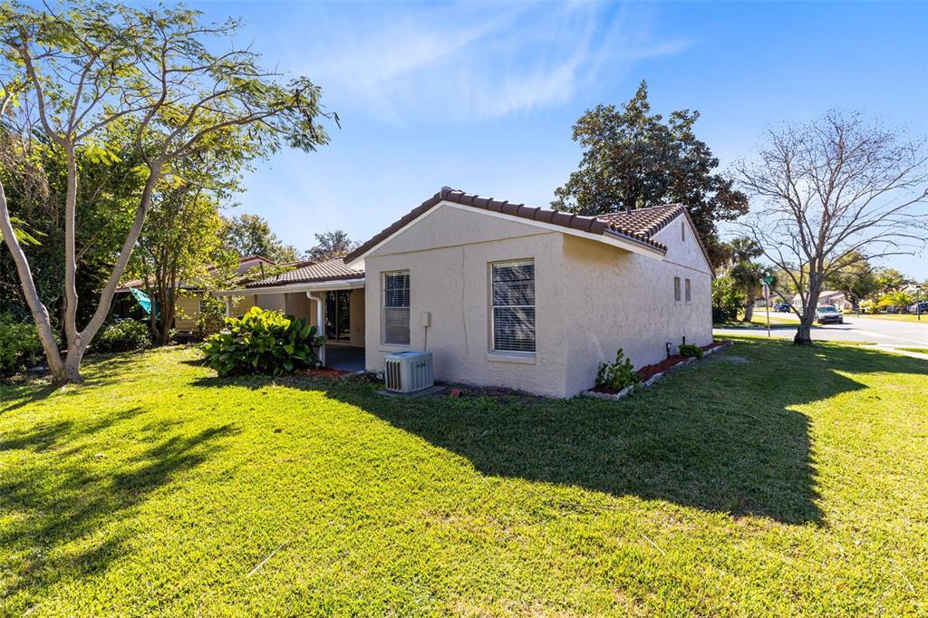 5331 Maize Street Orlando, FL 32821 - Photo 25 of 35 a front view of a house with garden