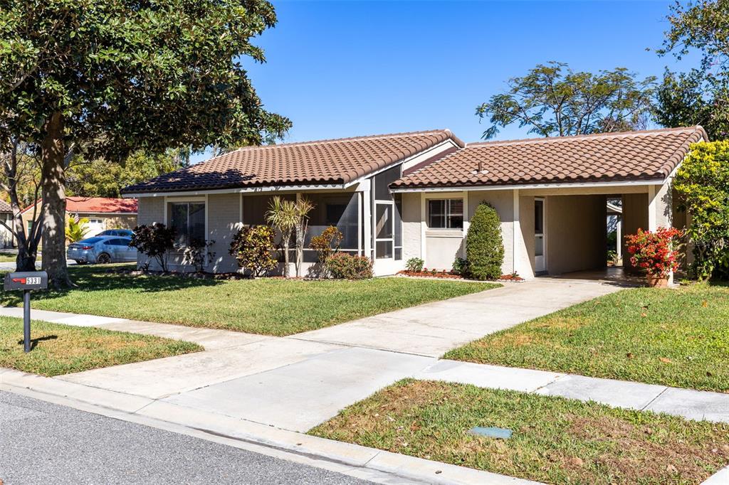 5331 Maize Street Orlando, FL 32821 - Photo 3 of 35 a front view of a house with garden