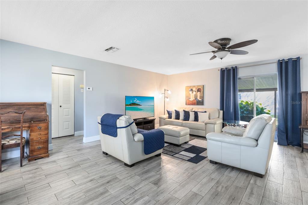5331 Maize Street Orlando, FL 32821 - Photo 9 of 35 a living room with furniture and a fireplace