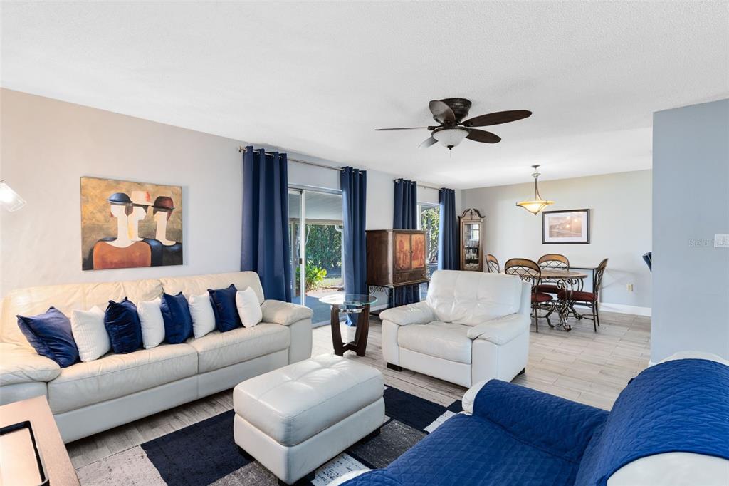 5331 Maize Street Orlando, FL 32821 - Photo 10 of 35 a living room with furniture ceiling fan and a rug