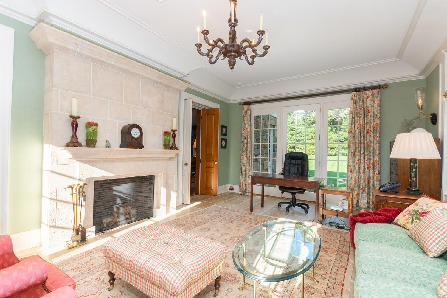 300 Brookside Road Darien, CT 06820 - Photo 17 of 58 a living room with furniture a fireplace and a large window