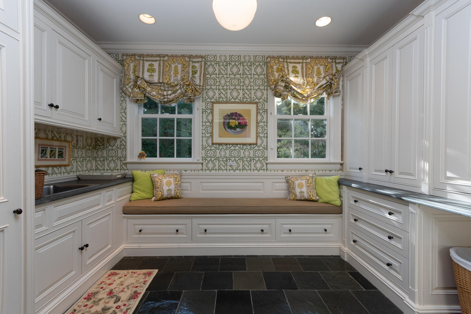 300 Brookside Road Darien, CT 06820 - Photo 23 of 58 a kitchen with white cabinets and a window