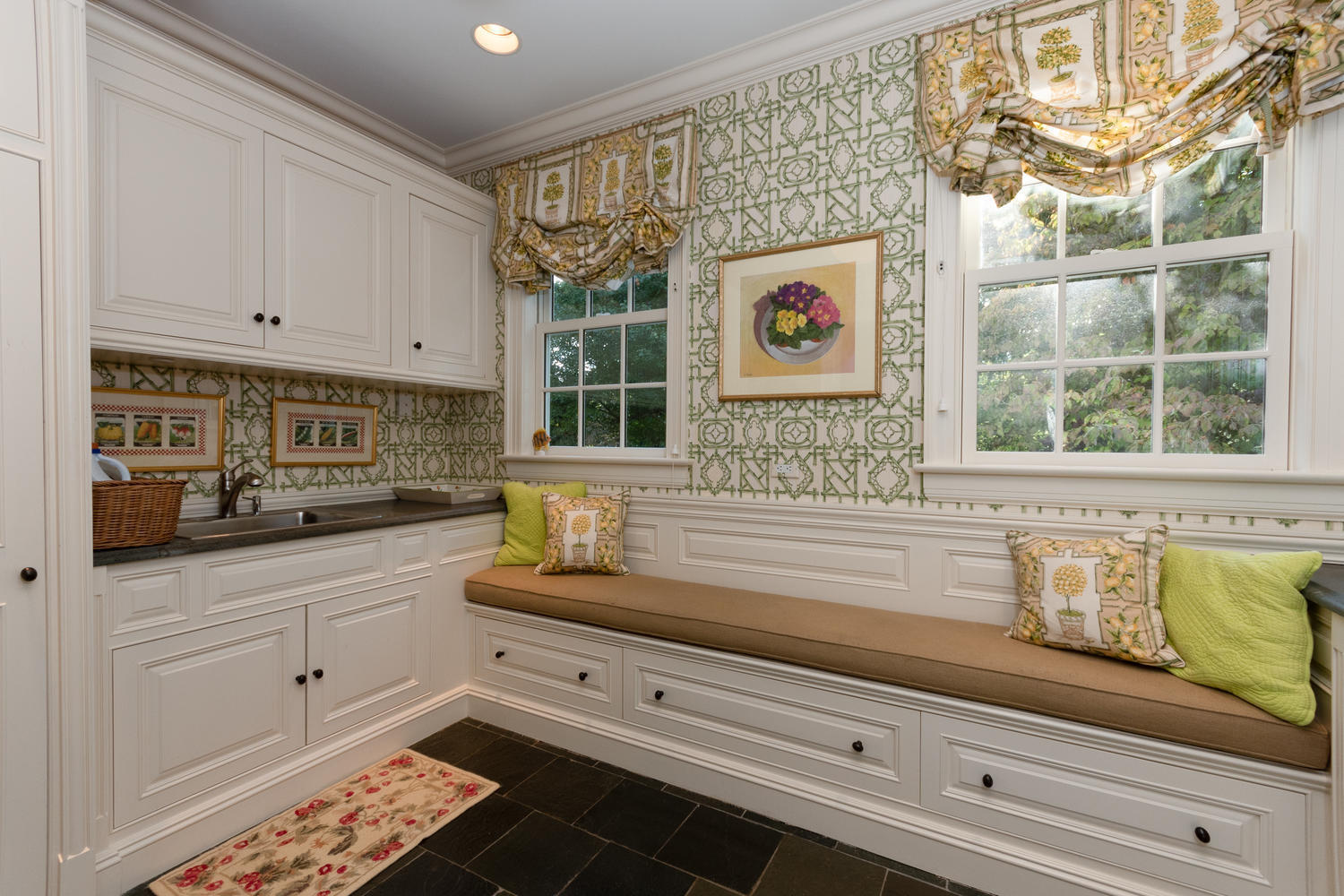 300 Brookside Road Darien, CT 06820 - Photo 24 of 58 a kitchen with granite countertop white cabinets and window