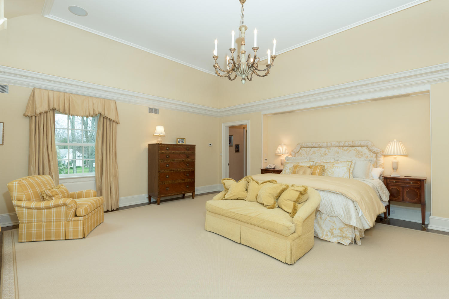 300 Brookside Road Darien, CT 06820 - Photo 27 of 58 a spacious bedroom with a bed and couch chandelier